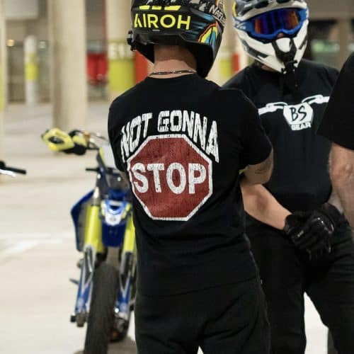 Not Gonna Stop T-Shirt — black tee worn, natural light